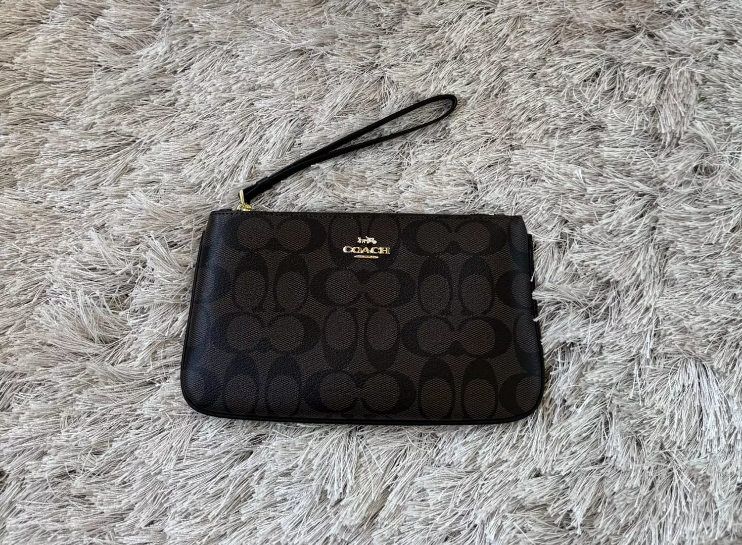 Coach wristlet in signature canvas 1