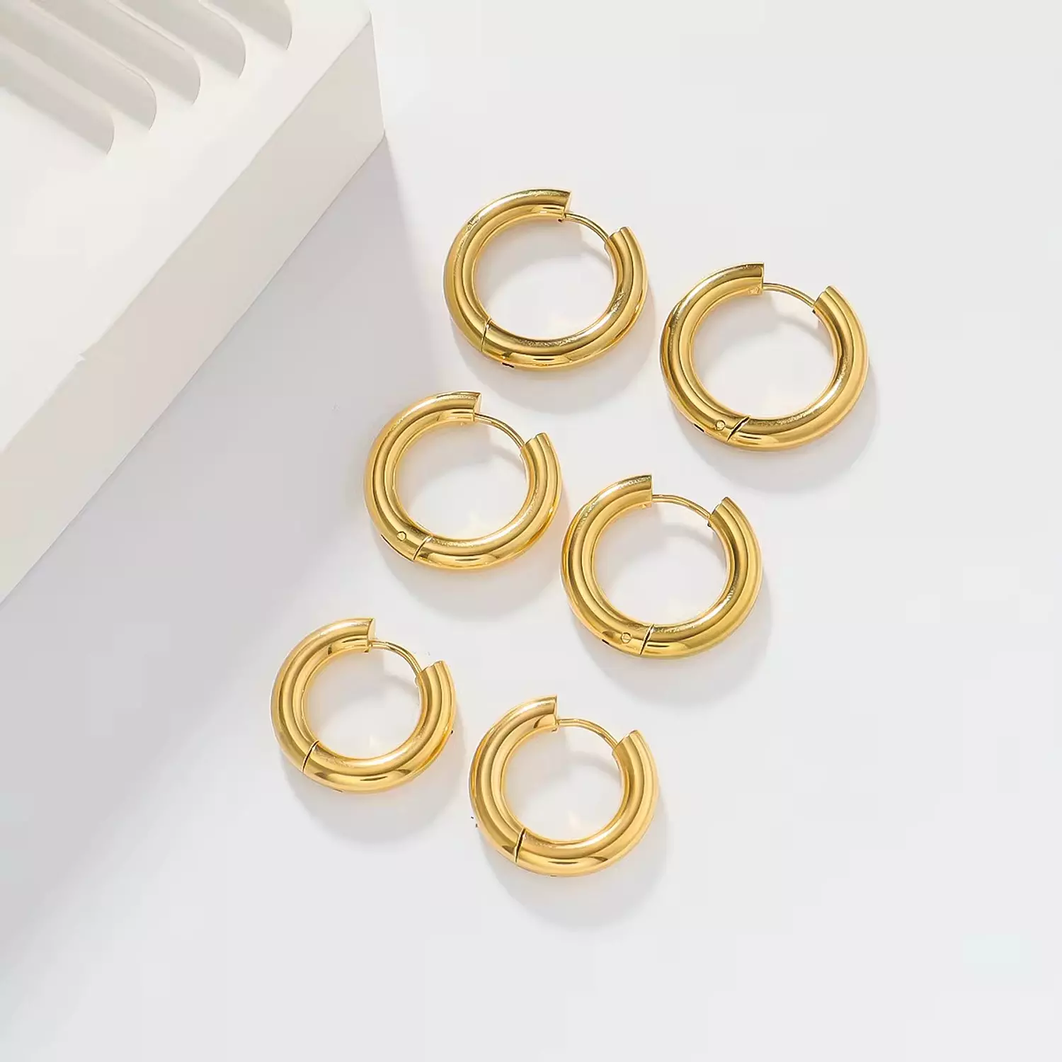 Plain gold hoop earrings hover image
