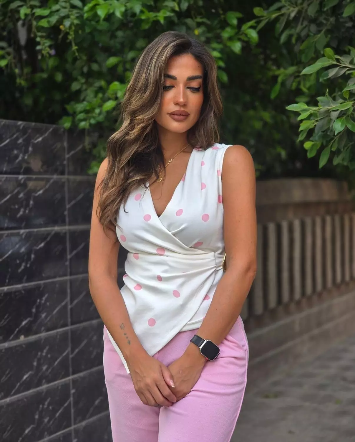 Pink polka top w gold accessory  image
