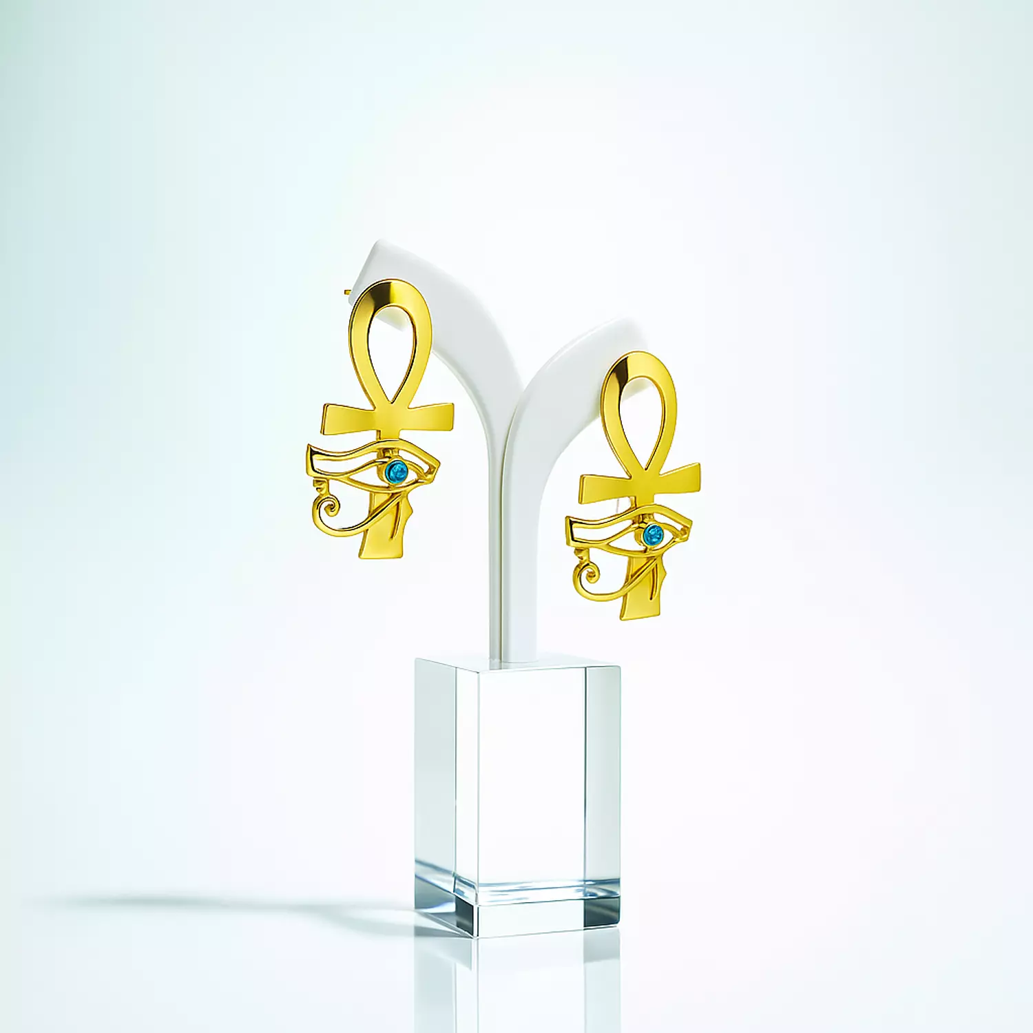 Two-layer copper earring, gold-plated, shiny and with a natural stone, the key of life and the eye of Horus hover image