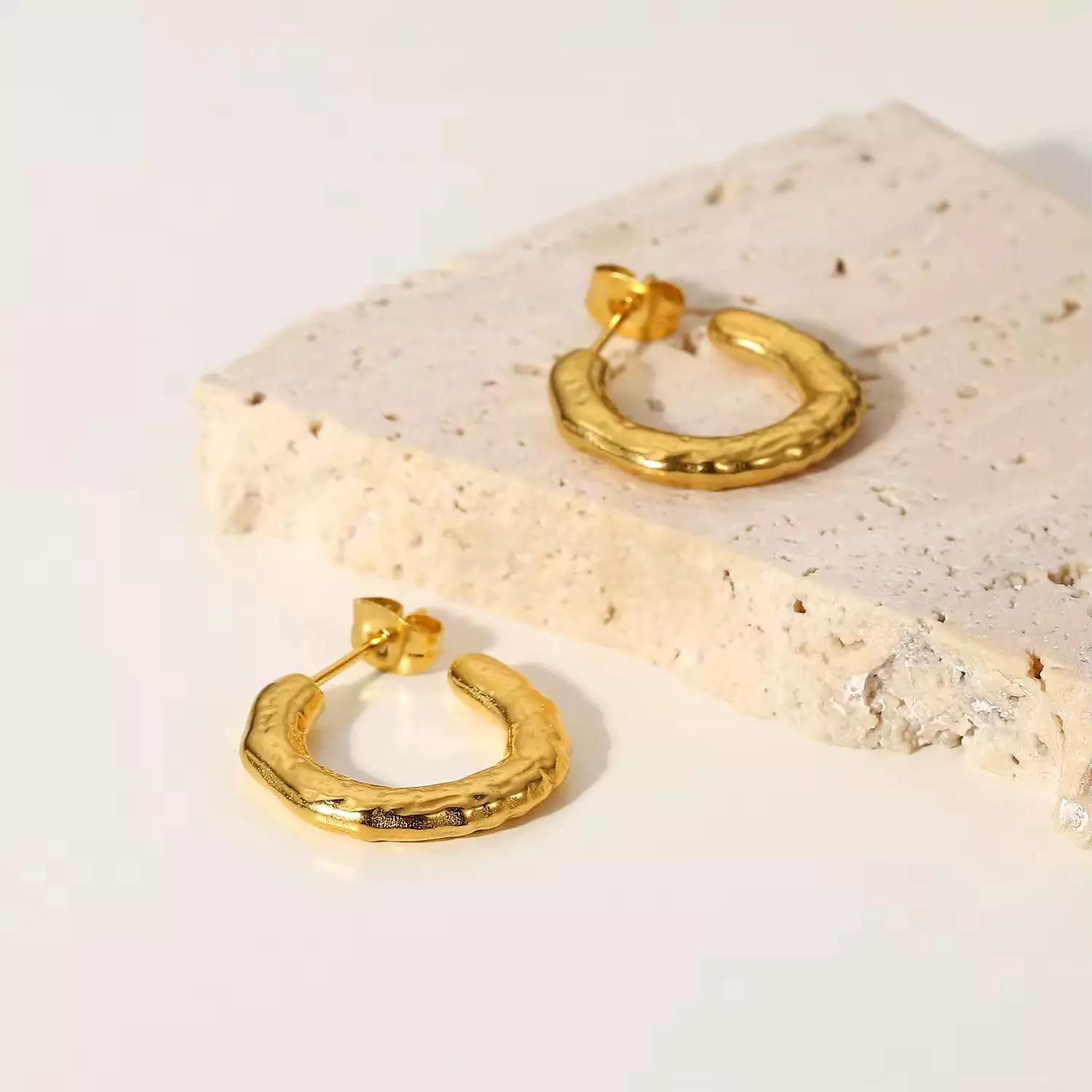 Irregular gold hoop earrings  hover image