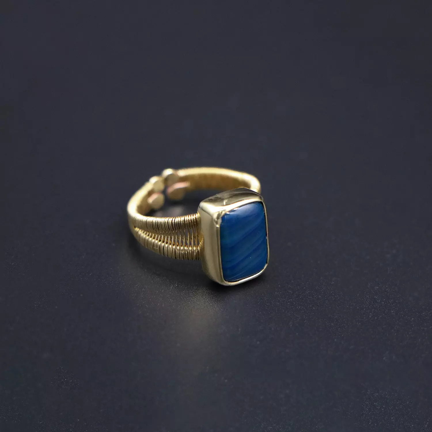 Brass ring with blue agate gemstone. image