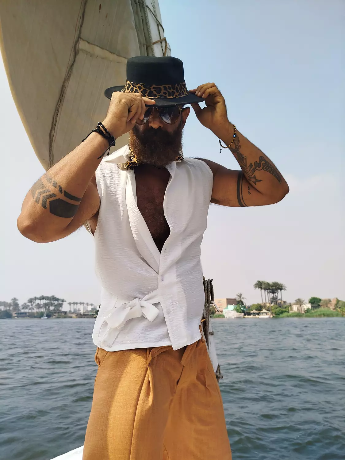 Crossed white lenin sleeveless shirt with side tie  hover image