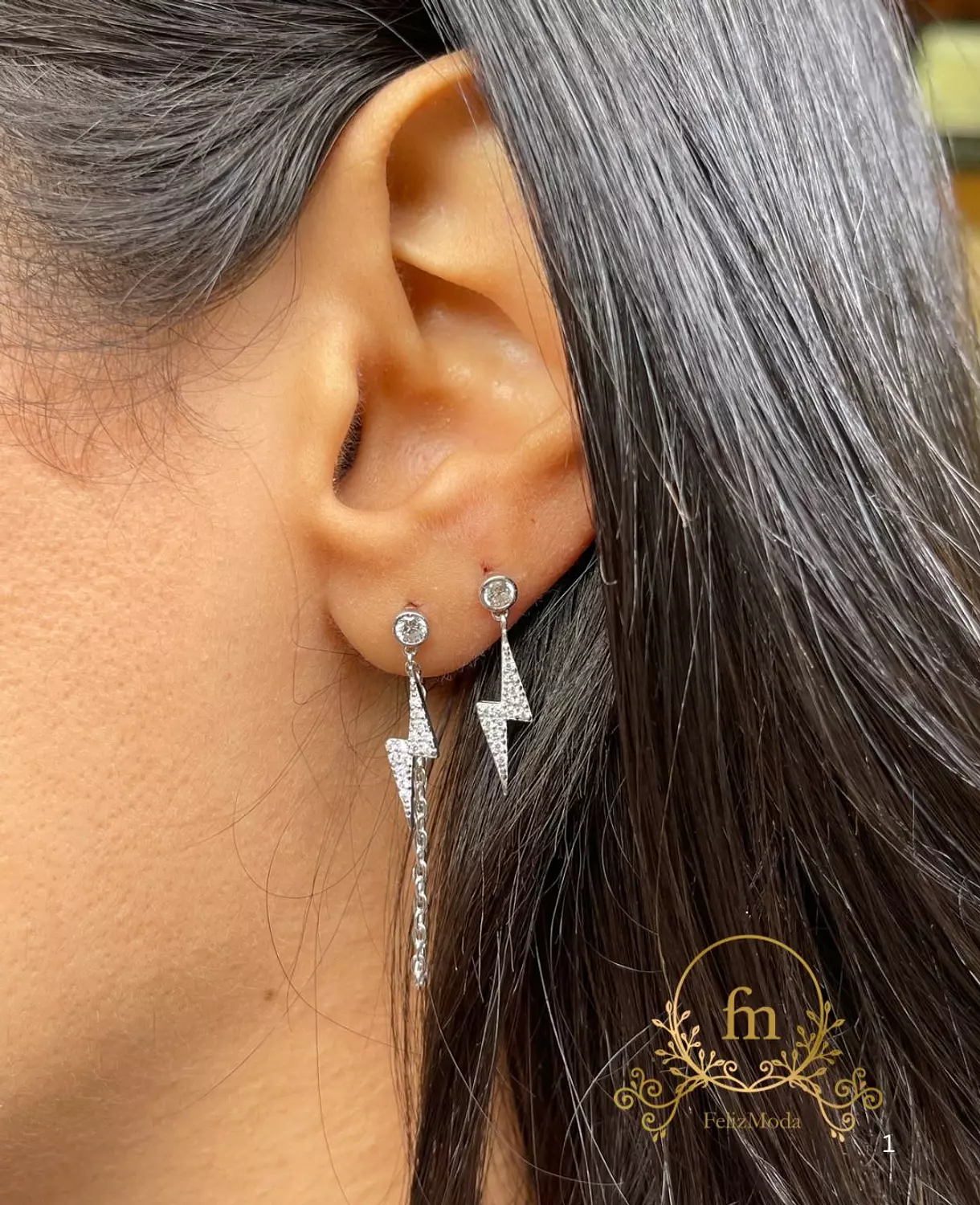 Two pieces flash star silver earrings one plain , one with connected chain image