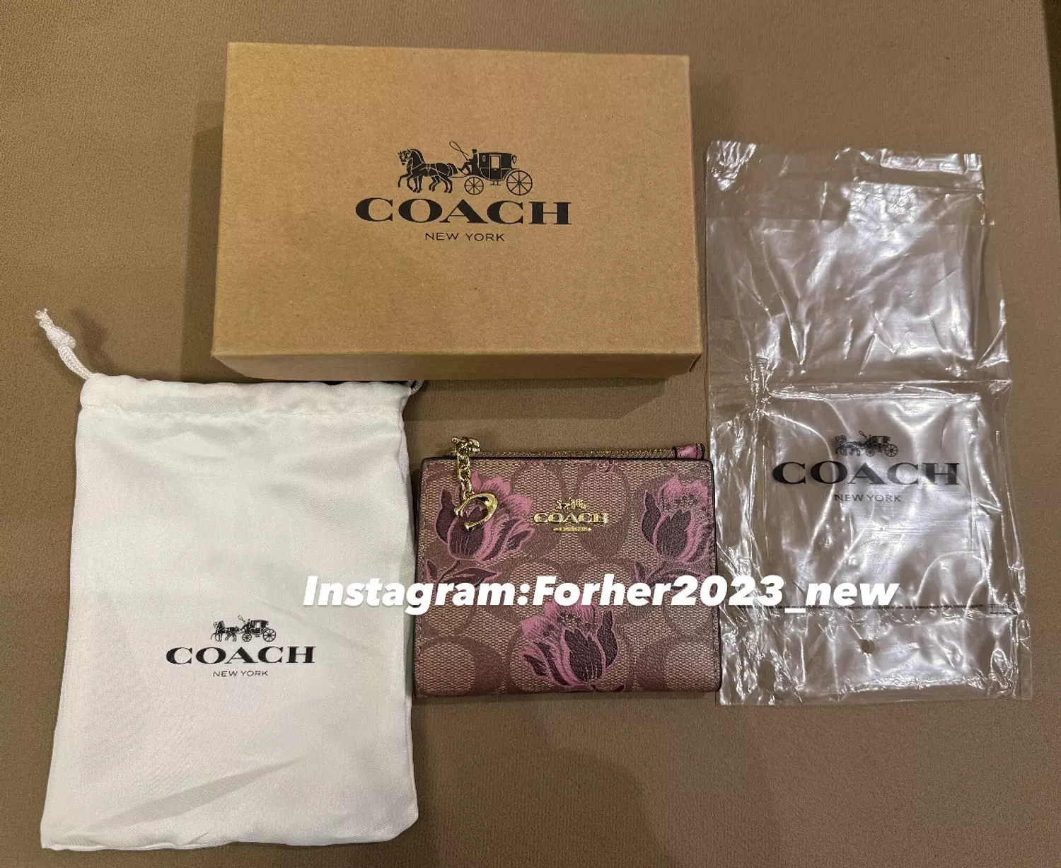 Coach bifold wallet light brown with pinkish flowers 1
