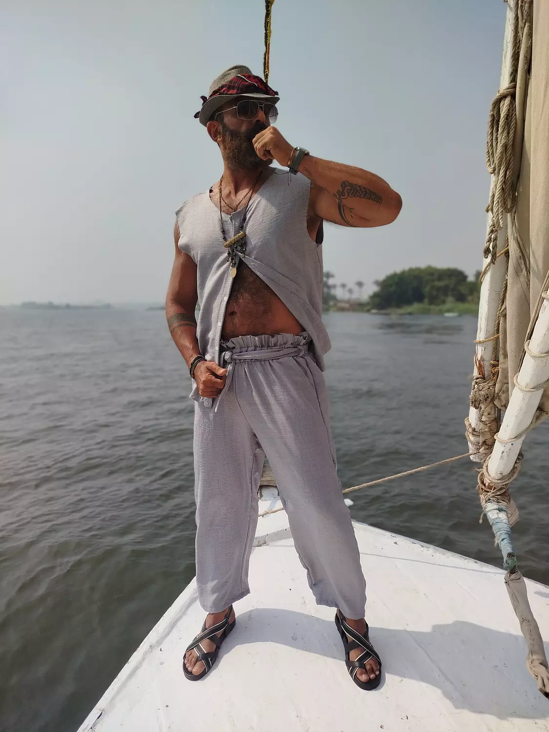 A light grey linen sleeveless shirt. hover image