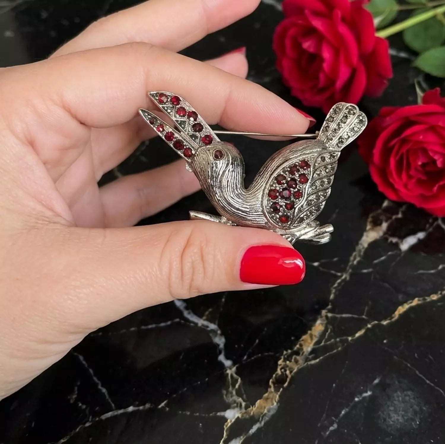 Bird with garnet stones image