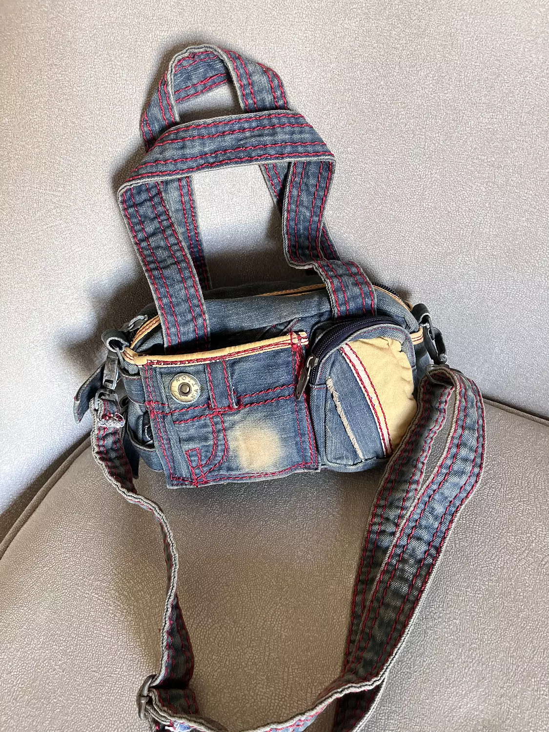Denim diesel bag with pink stitching hover image