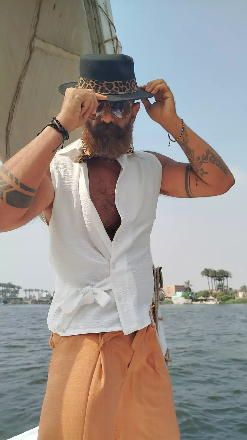 Crossed sleeveless white lenin shirt with side tie  hover image