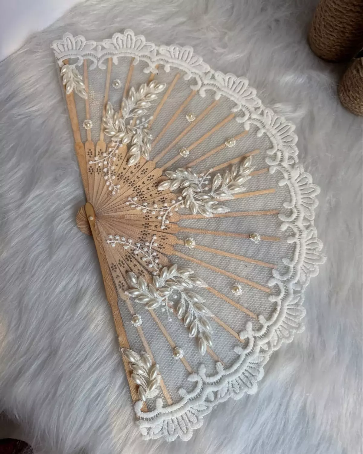 Lace fan adorned with elegant embroidery image