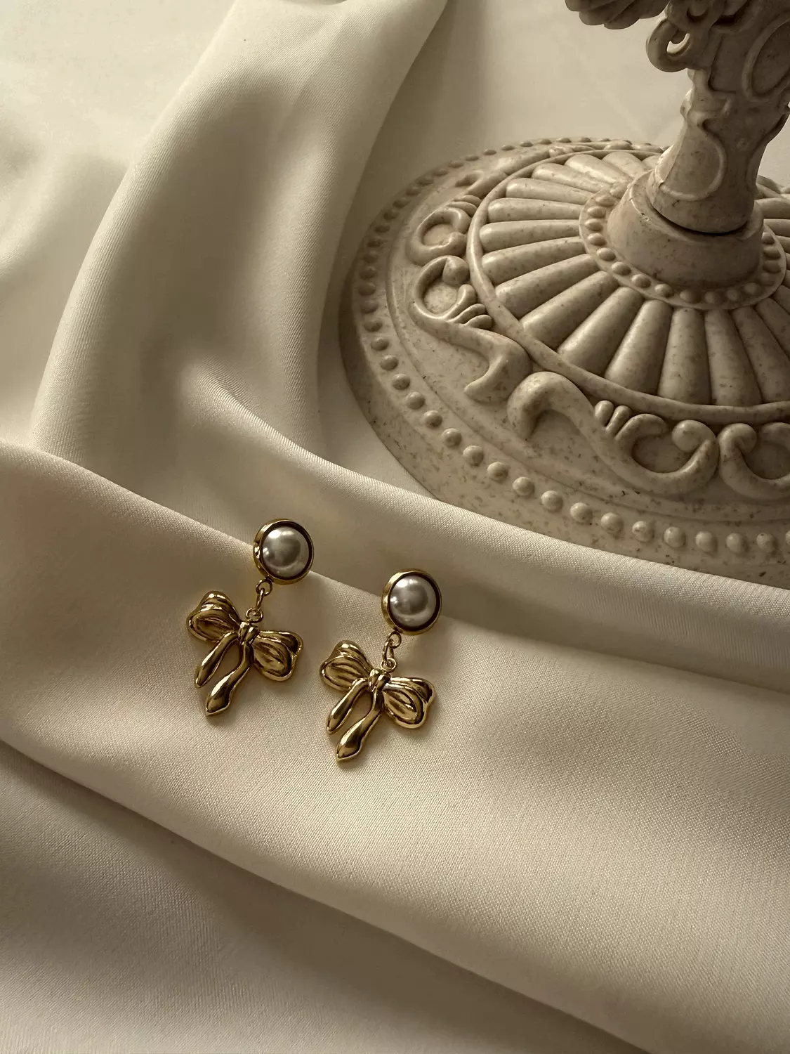 Pearl x Bow Studs image
