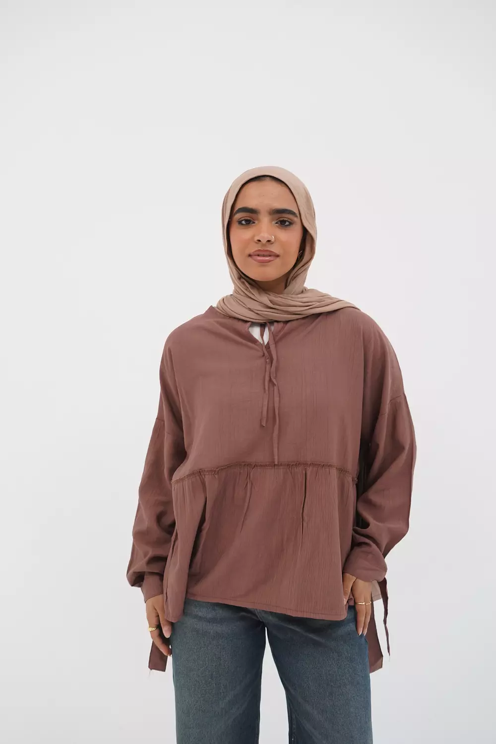 Brown blouse with tie from the callar image