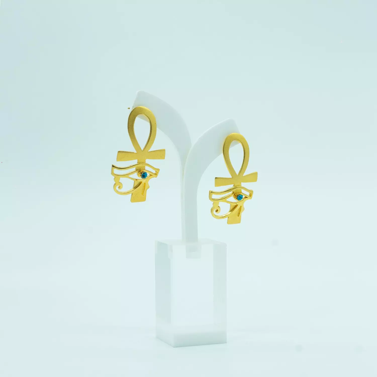 Two-layer copper earring, gold-plated, shiny and with a natural stone, the key of life and the eye of Horus image