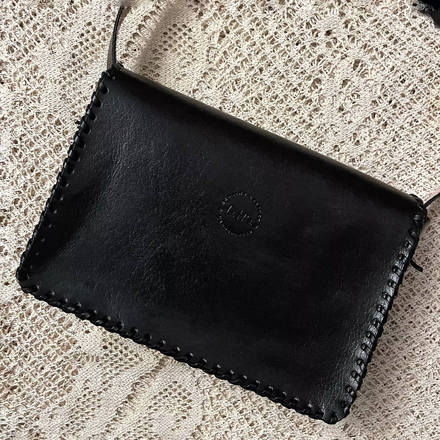 Tooled floral rectangular flap leather bag 10