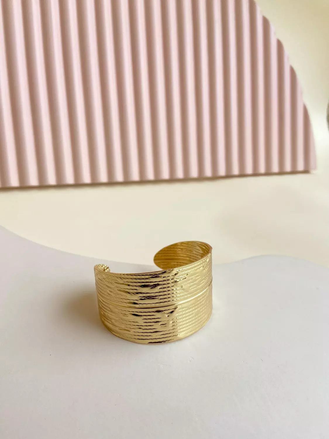 Wide gold bangle image