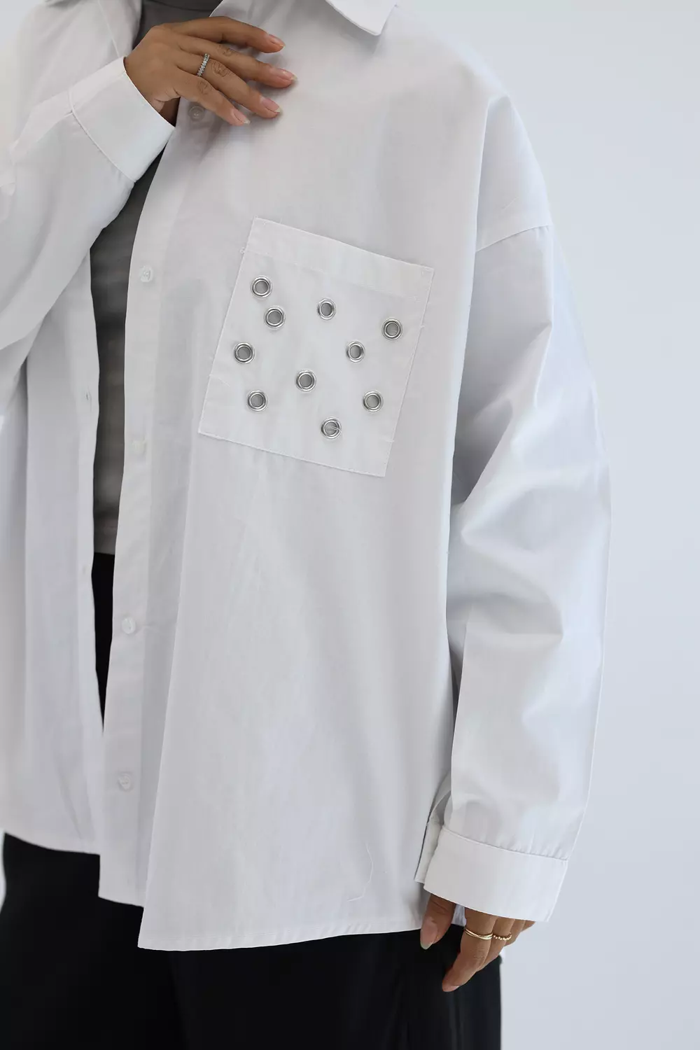 White shirt with metal circles on pockets 4