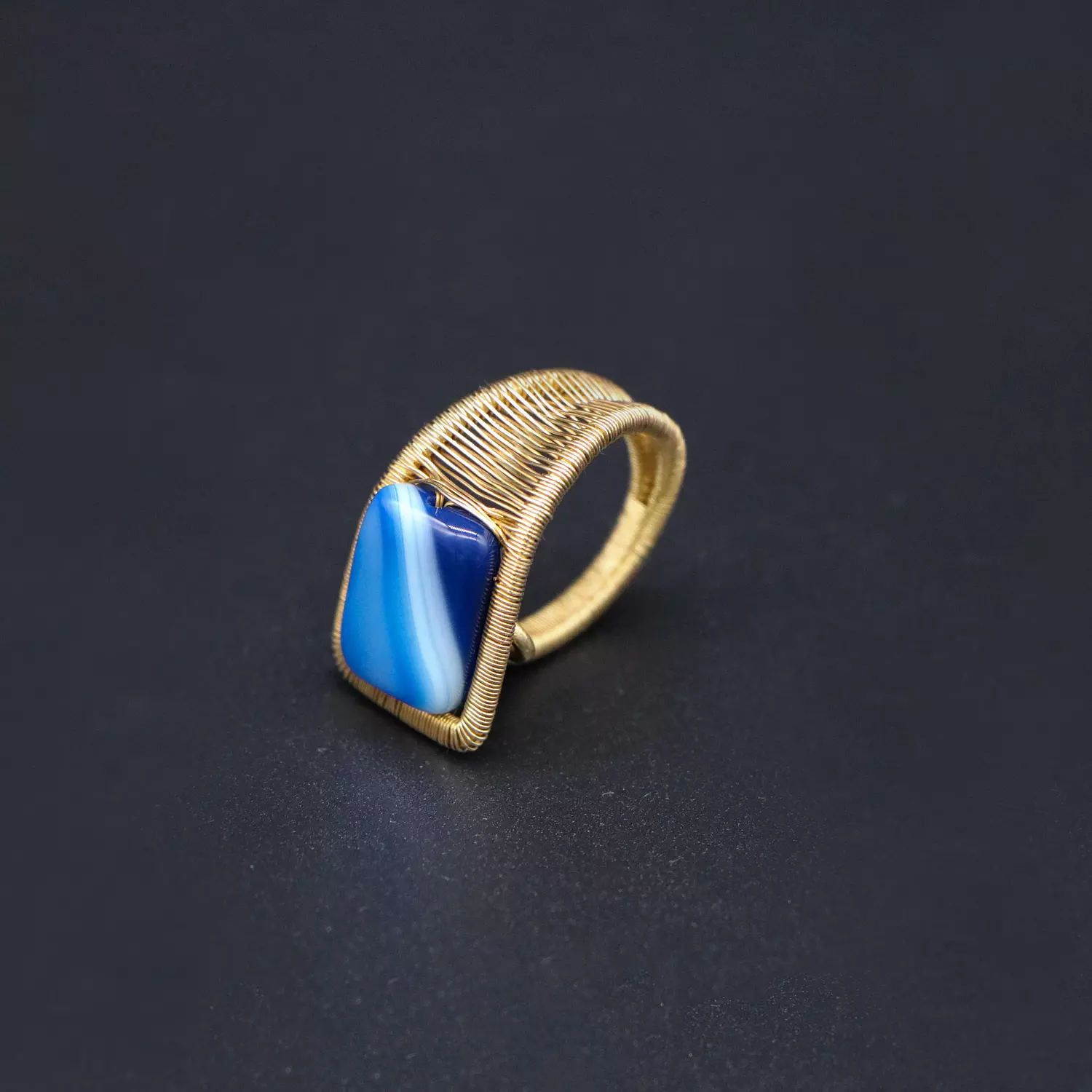 Brass ring with blue agate gemstone. image