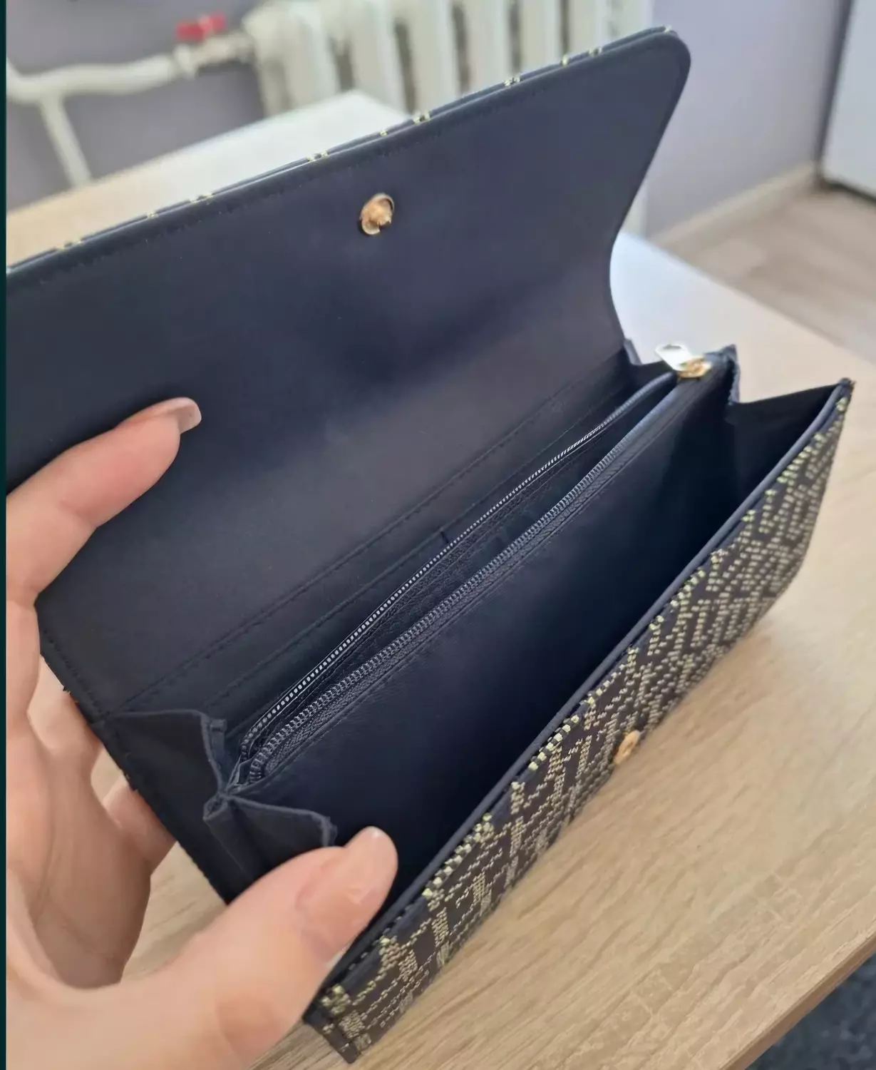 A  sleek envelope _style clutch or long  wallet  2