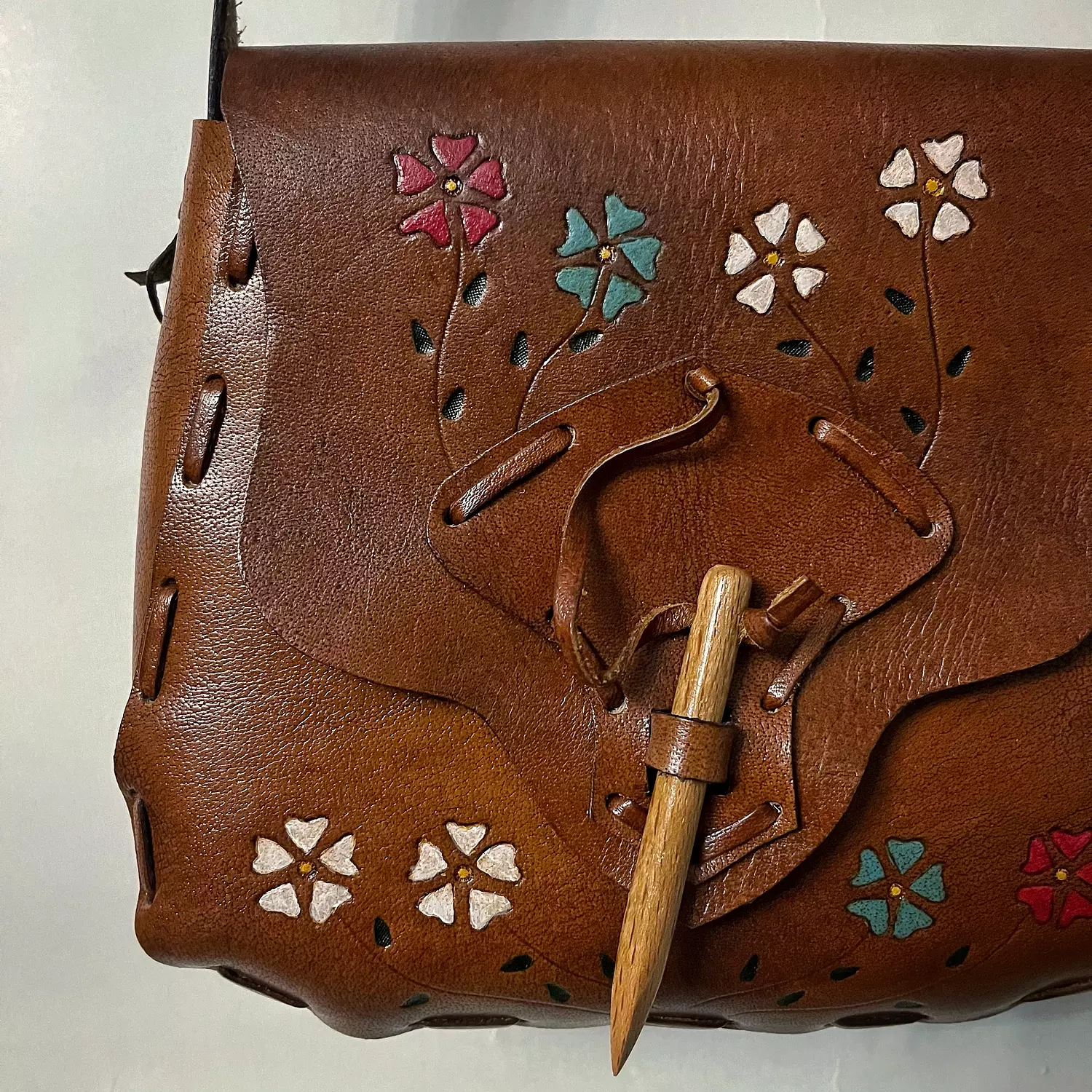 Hand painted flowers leather bag with wooden toggle clasp hover image