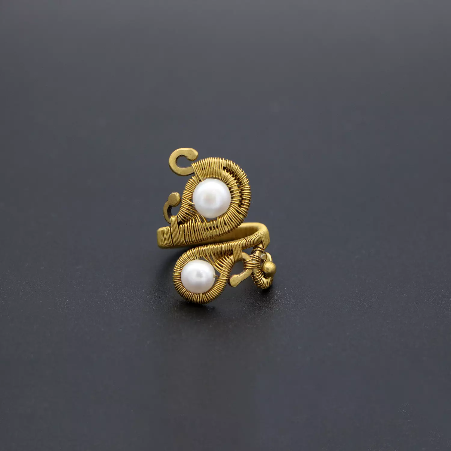 Brass ring with pearls. image