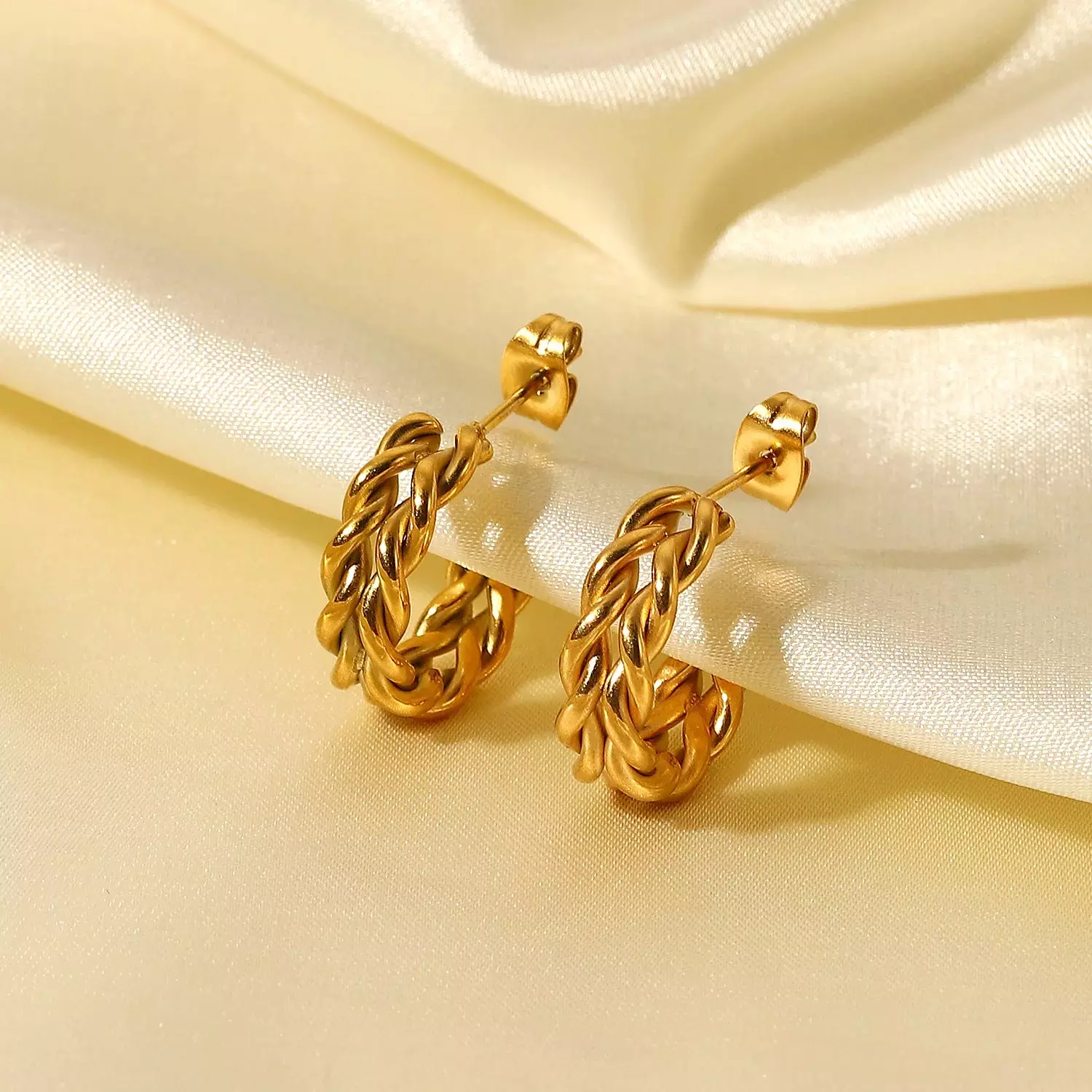 Twisted hoop earrings hover image