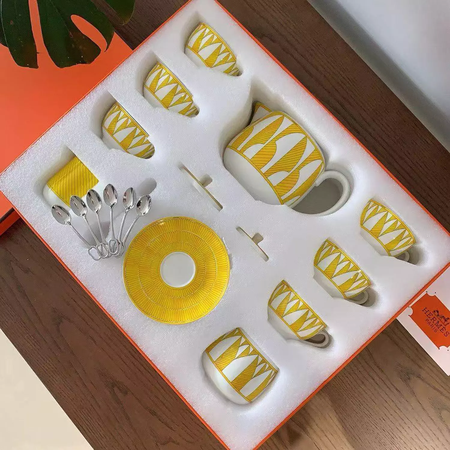 Hermès Soleil d'Hermès porcelain tea set in a bright yellow and white pattern image
