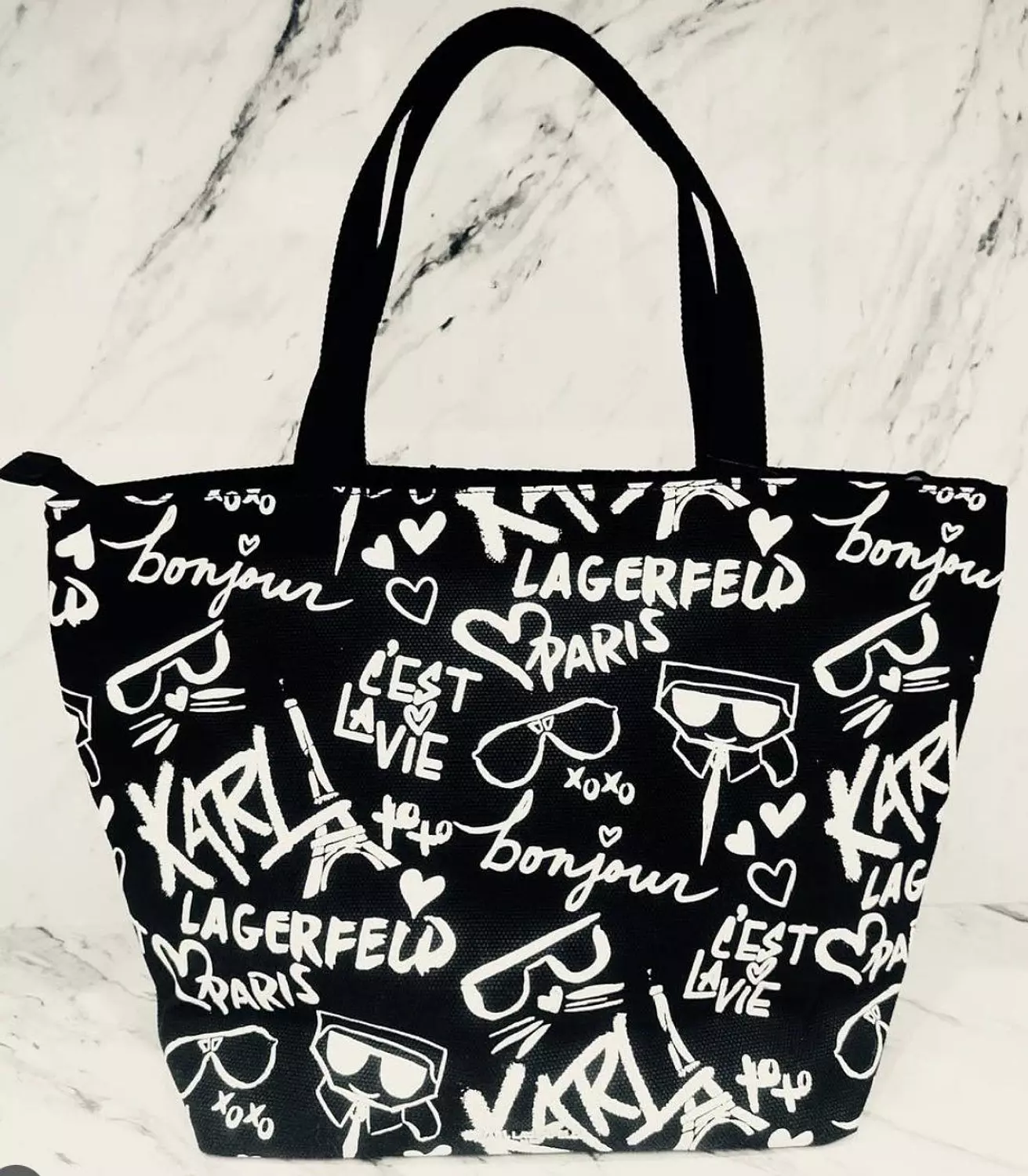ack Tote Bag featuring a white and black graffiti design inspired by Karl Lagerfeld. image