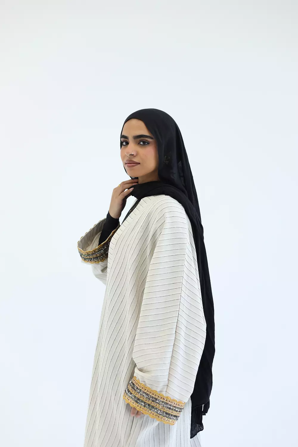 Striped cardigan with gold bracelet 2