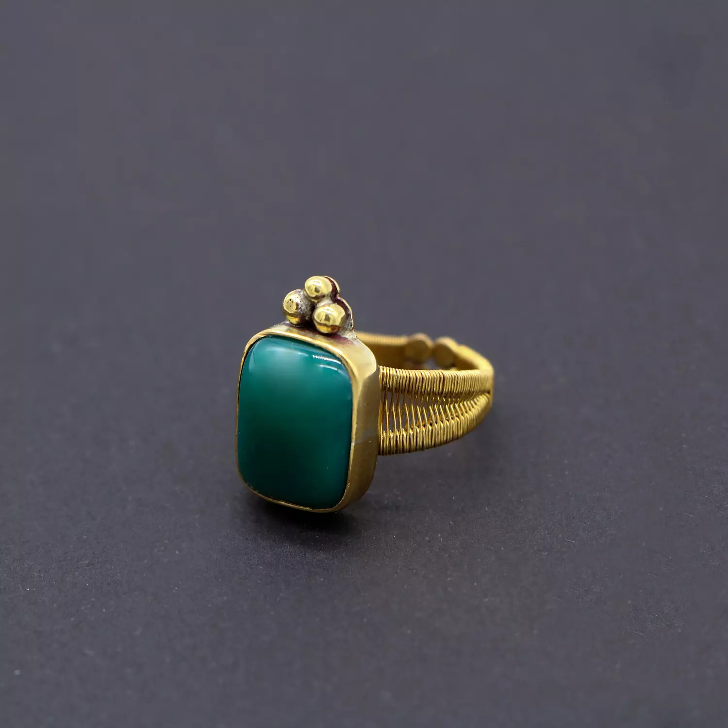 Brass ring with green agate gemstone. image