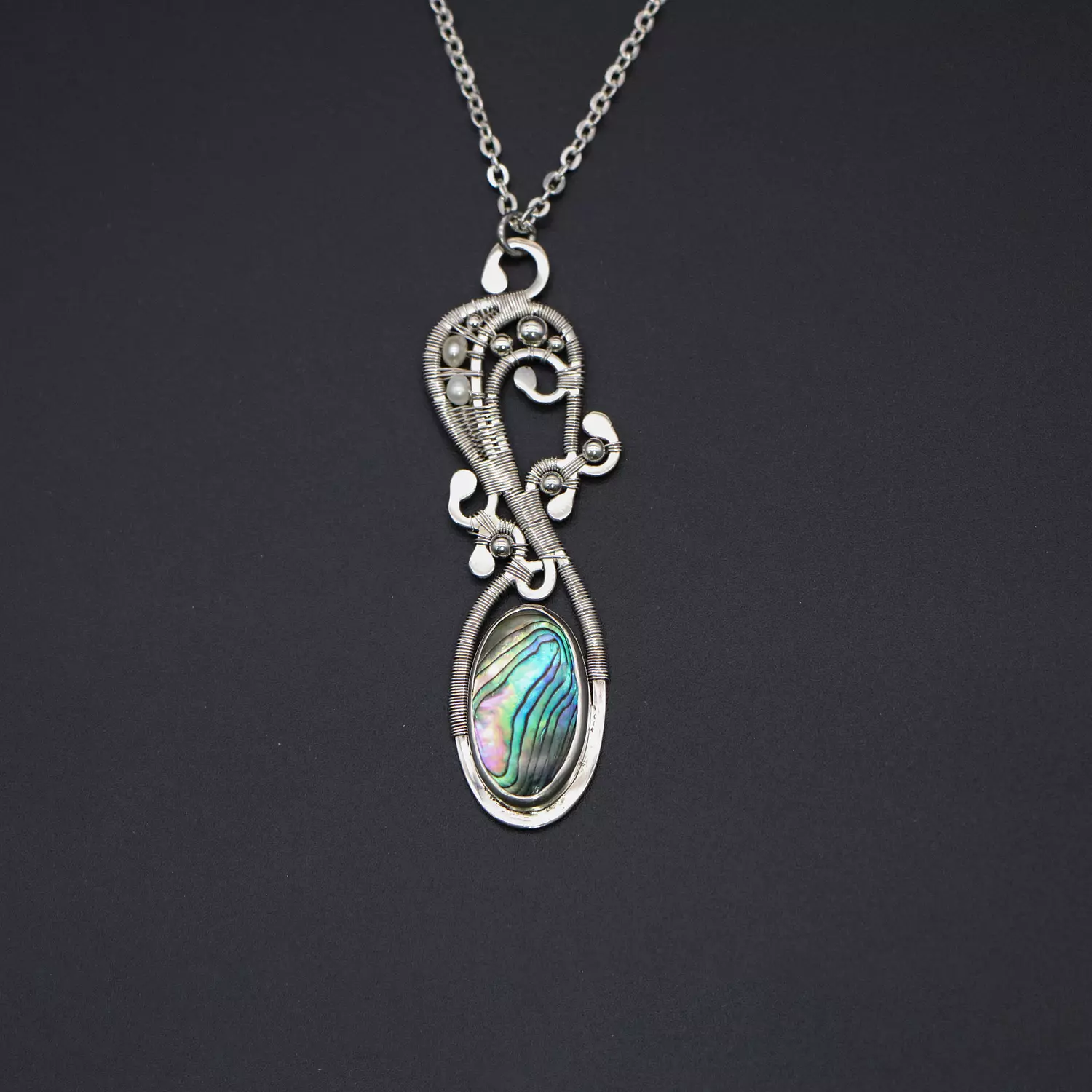 Silver necklace with abalone shell, pearls and silver balls. image