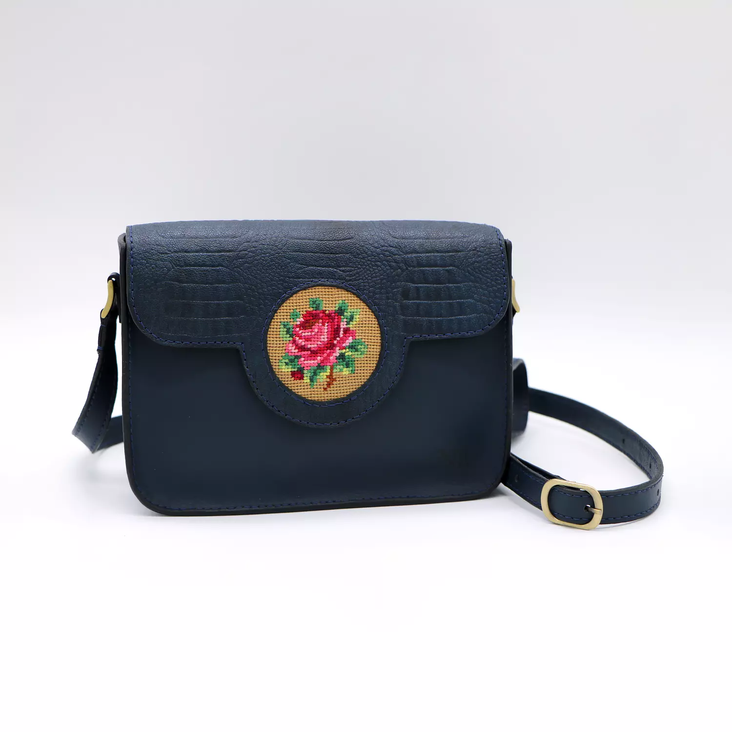 Genuine leather bag with floral design. image