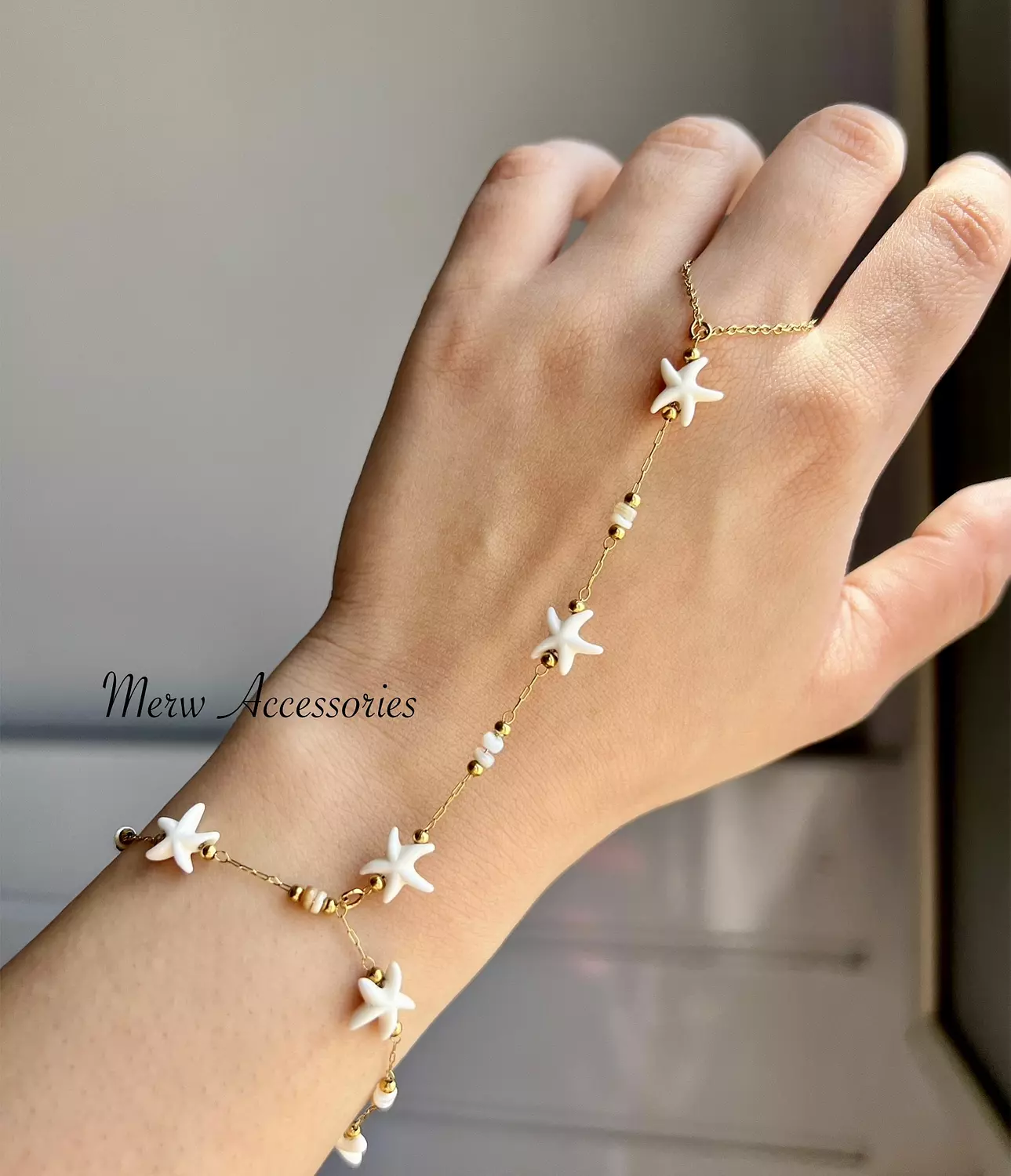 White stars hand chain  image