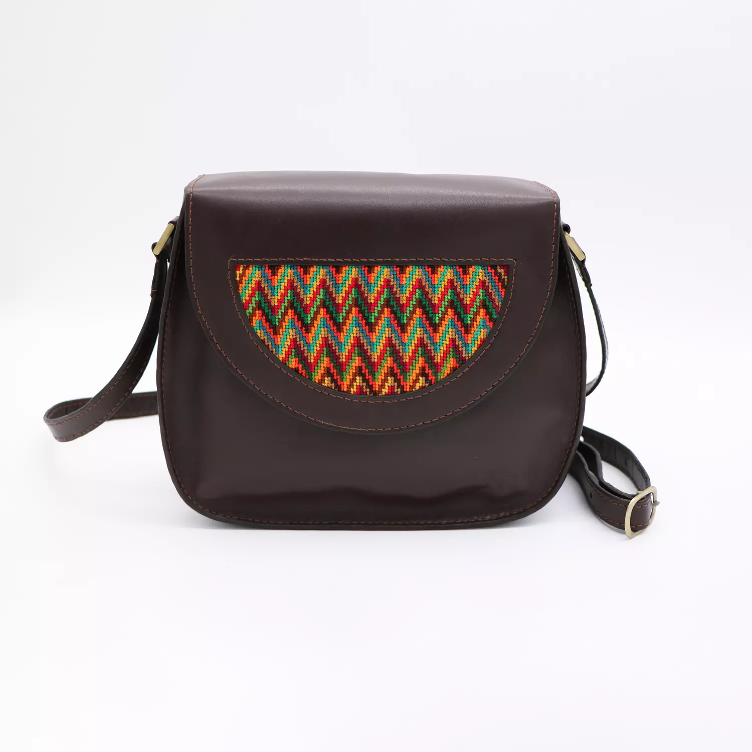 Dark brown genuine leather bag with colorful cross-stitching. image