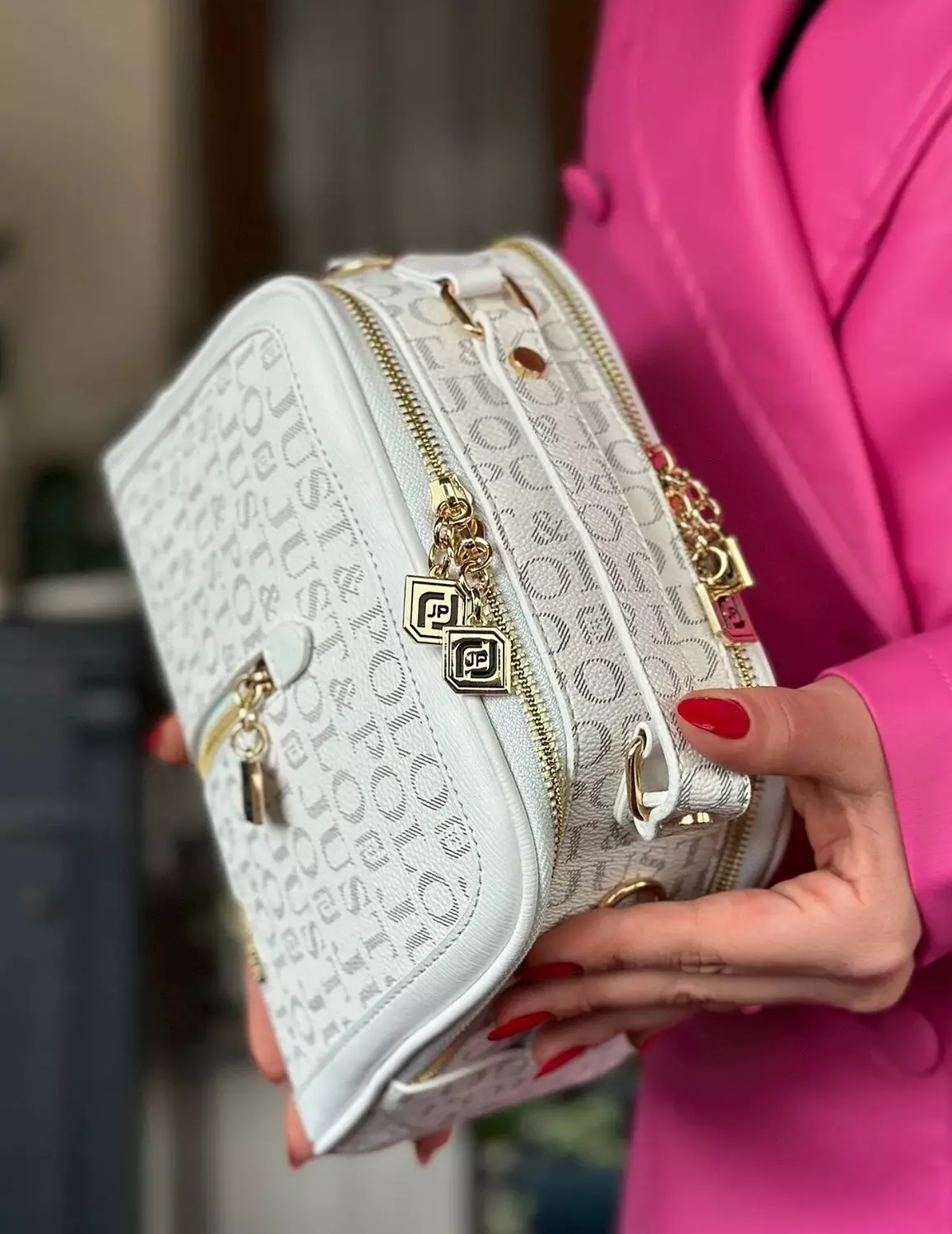 White Monogram Handbag with Gold Accents and Adjustable Strap hover image