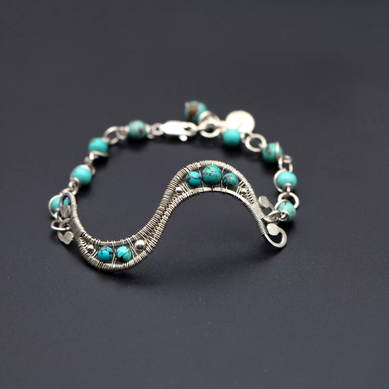 Wire wrapped silver bracelet  with turquoise gemstones. image