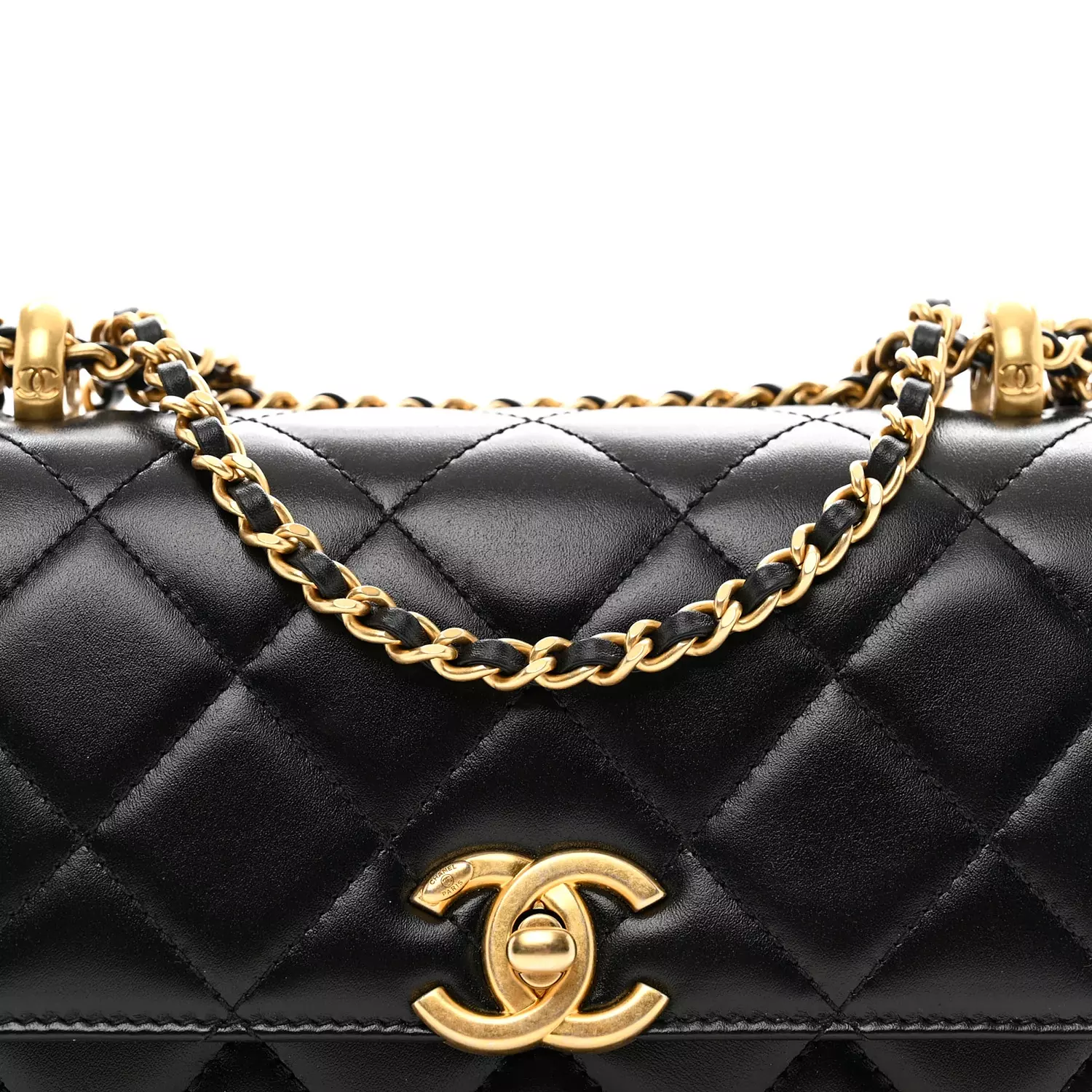 Chanel Small Flap Bag in black shiny calfskin leather features gold-tone meta 5