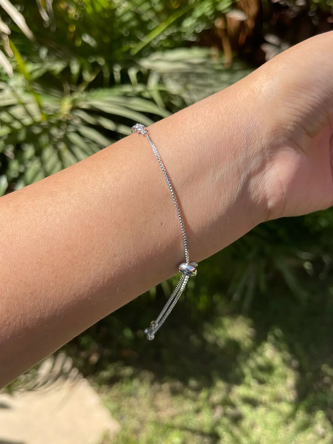 Half stones silver tennis bracelet with adjustable length hover image