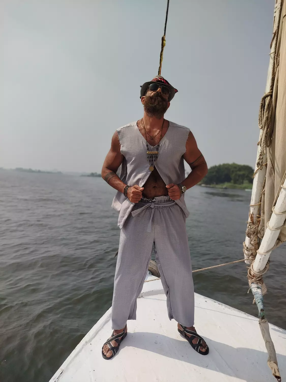 A light grey linen sleeveless shirt. image
