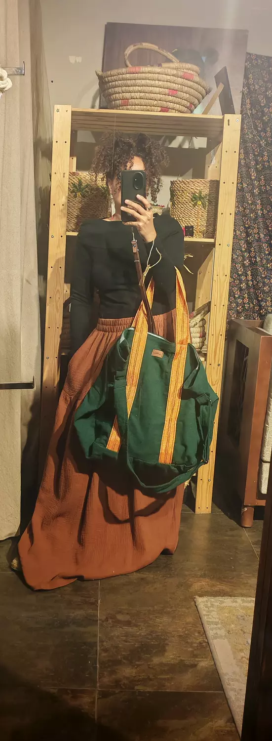 Extra large green bag with heavy duty orange strap image