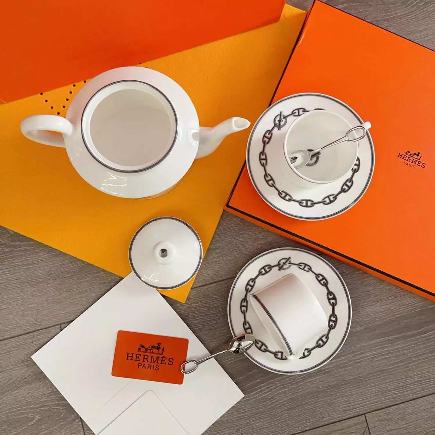 luxurious Hermès Chaine d'Ancre porcelain tea set in platinum silver, featuring iconic anchor chain motifs hover image