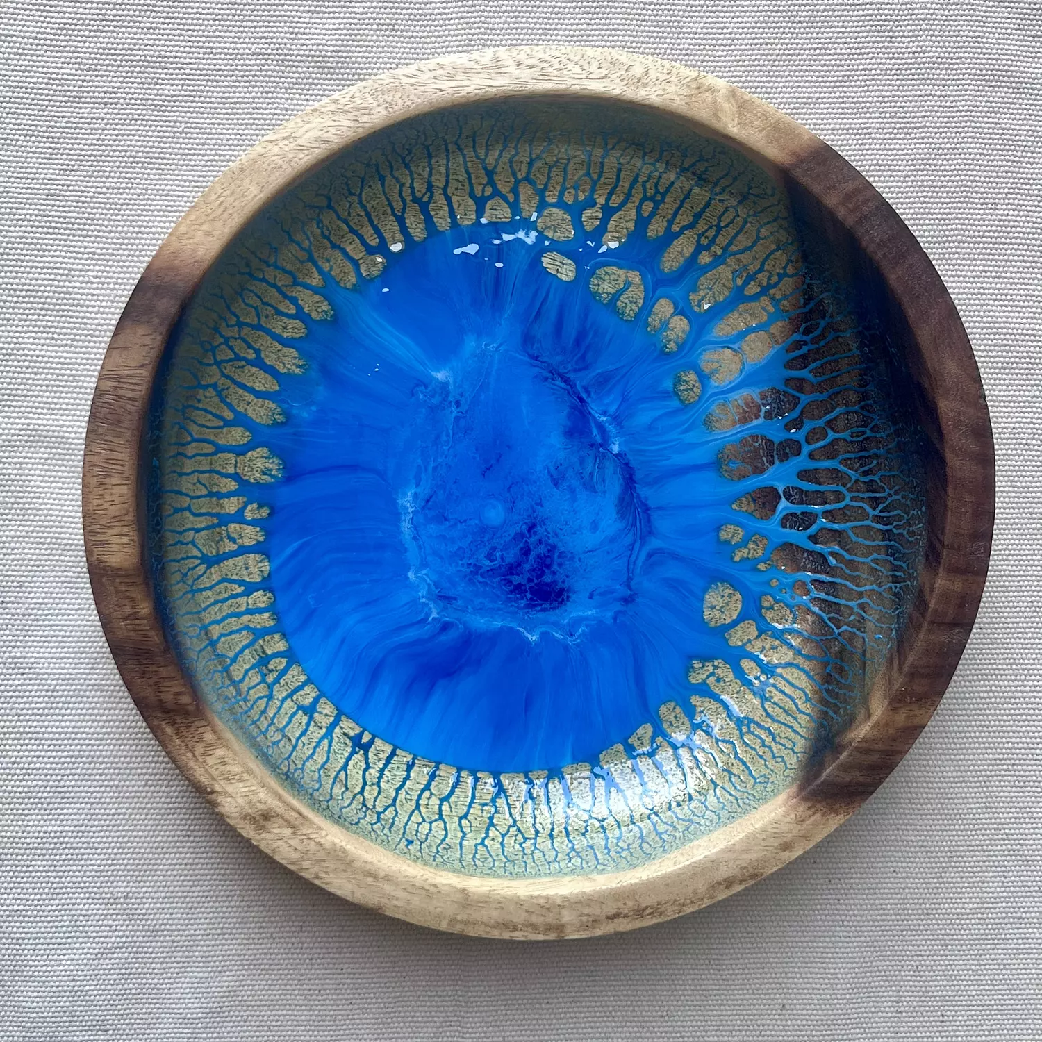 Blue light wooden bowl hover image