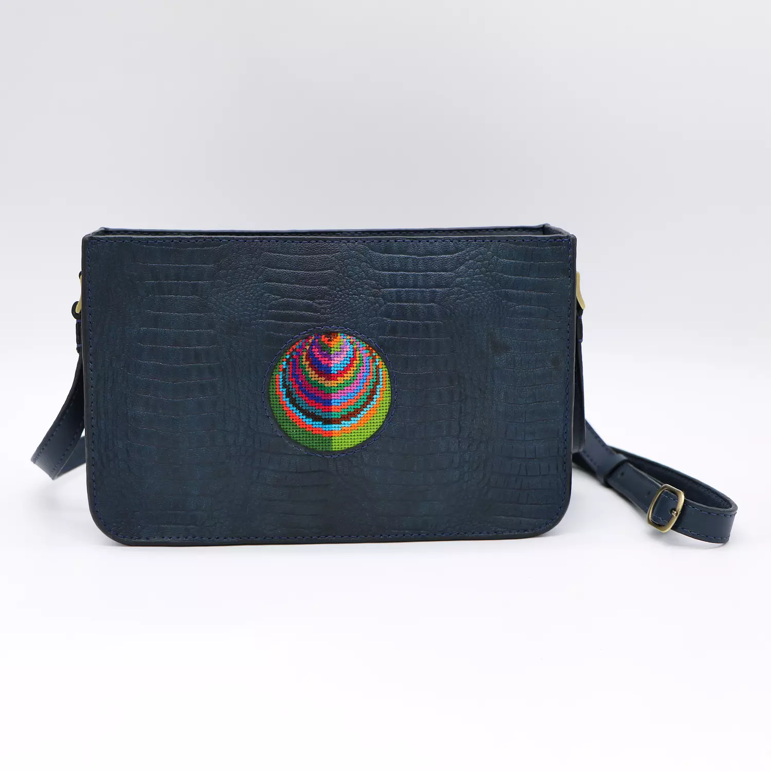 Dark blue genuine leather bag with colorful Cross stitching. image