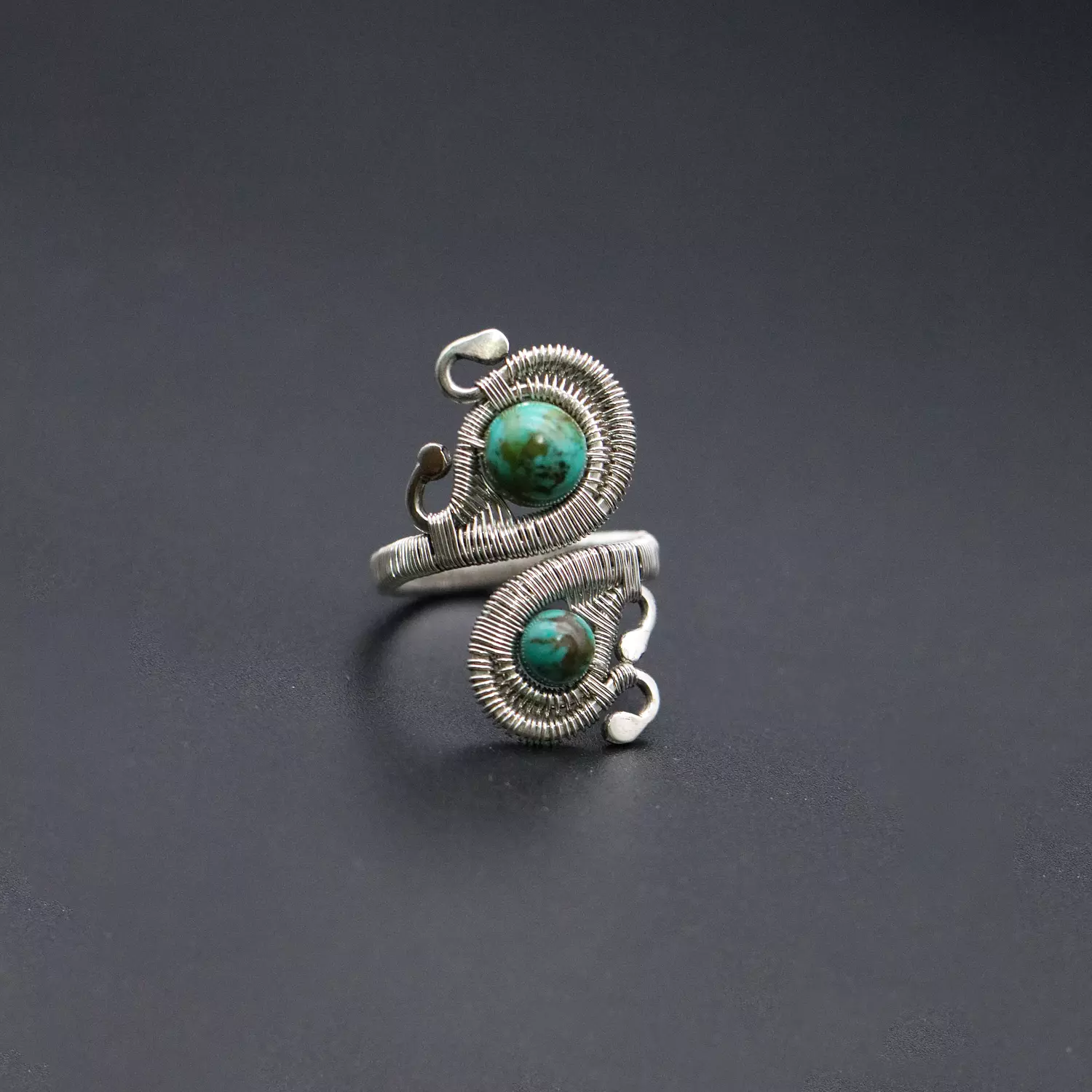 Silver ring with turquoise gemstones. image