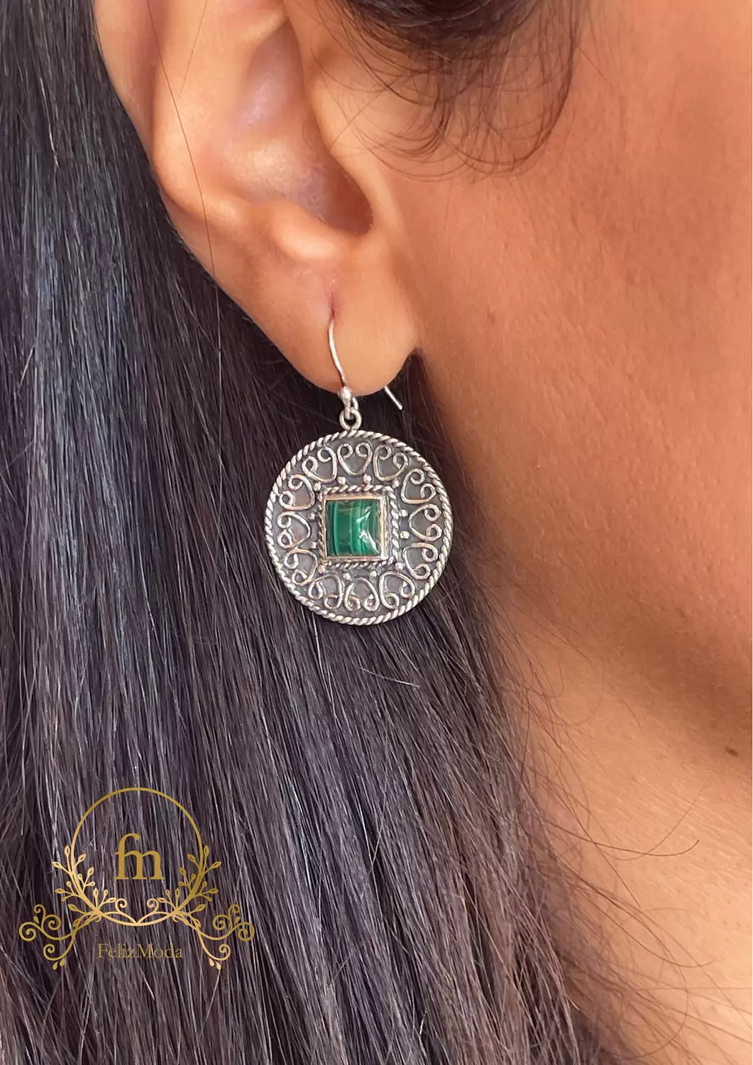 Round silver earrings with green stone image