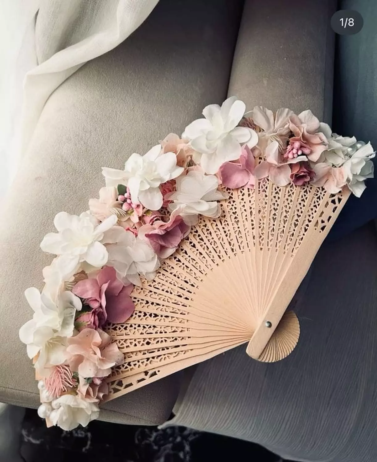 wooden fan with floral touches 1 image