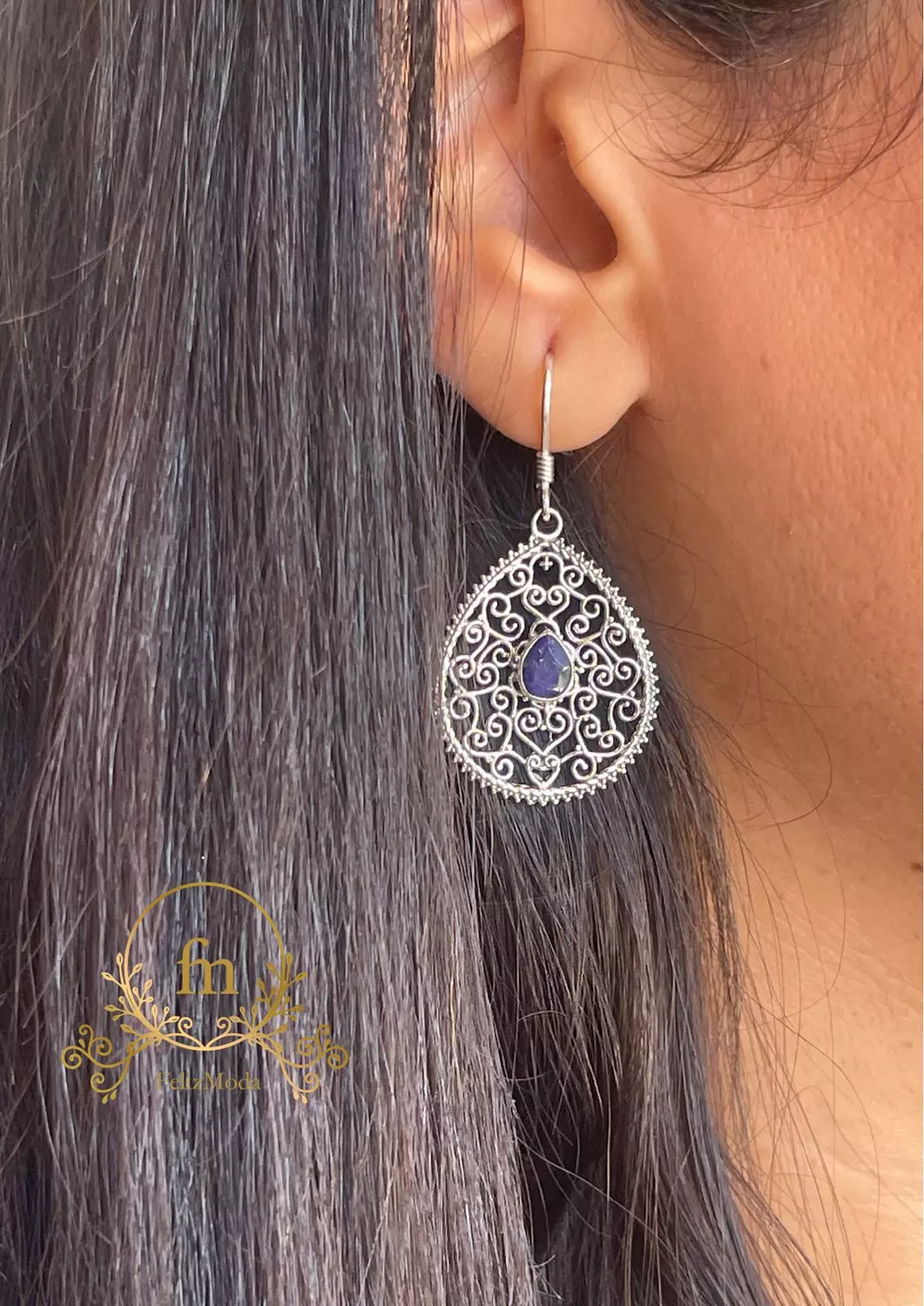 Unique designed earrings with purple stone image