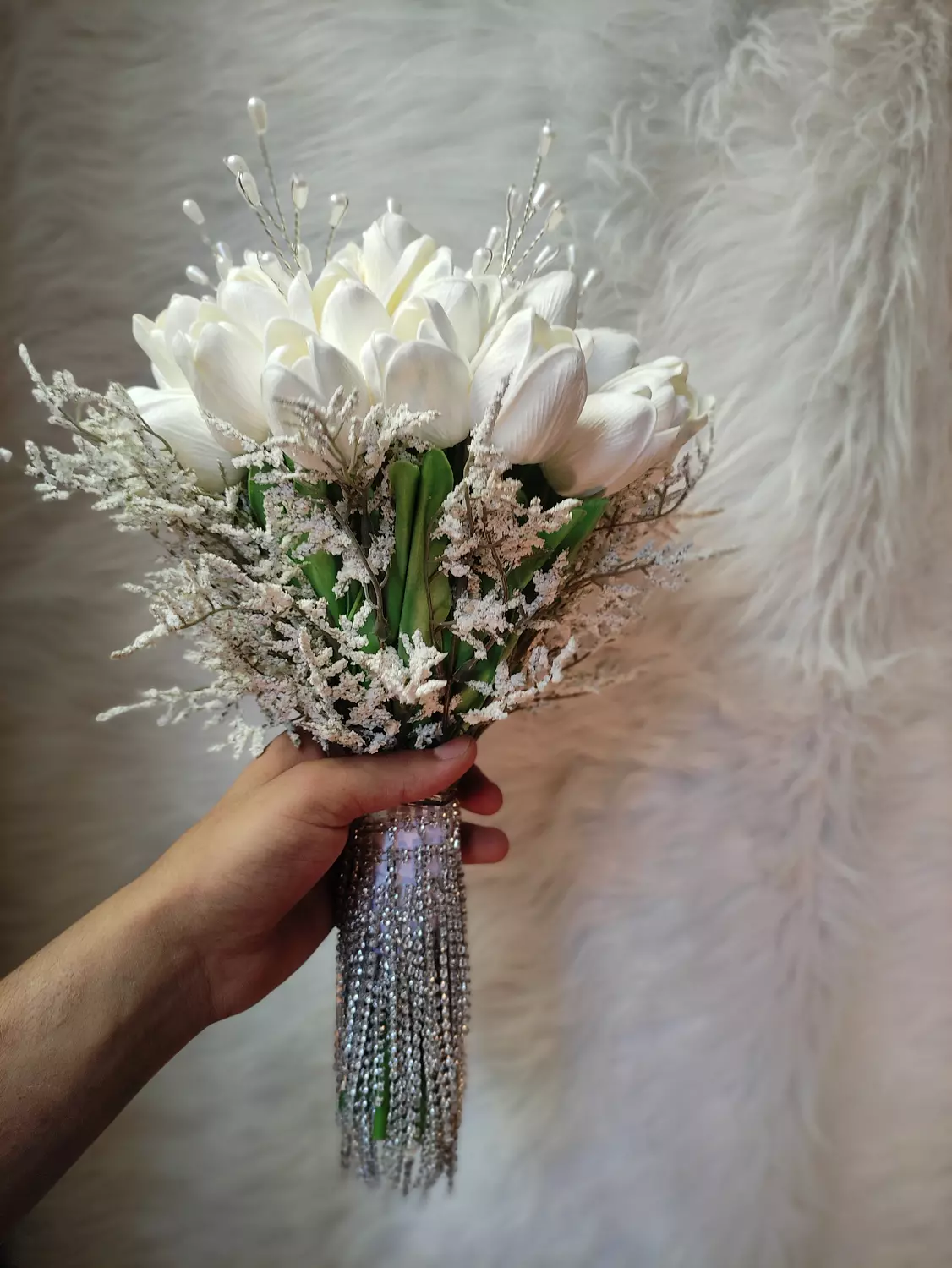 A stunning white tulip bouquet with soft almaaz accents image