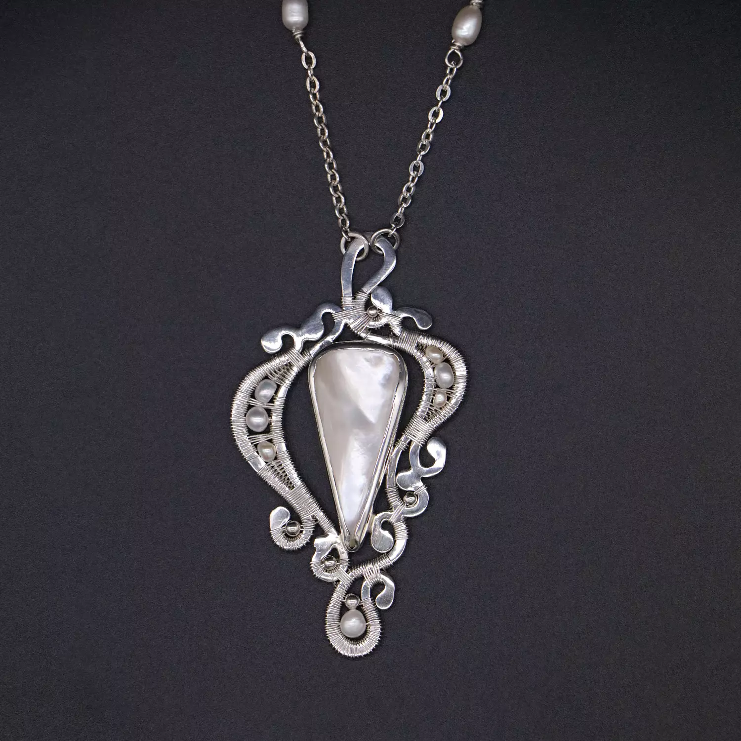 Silver pendant with mother of pearl. image