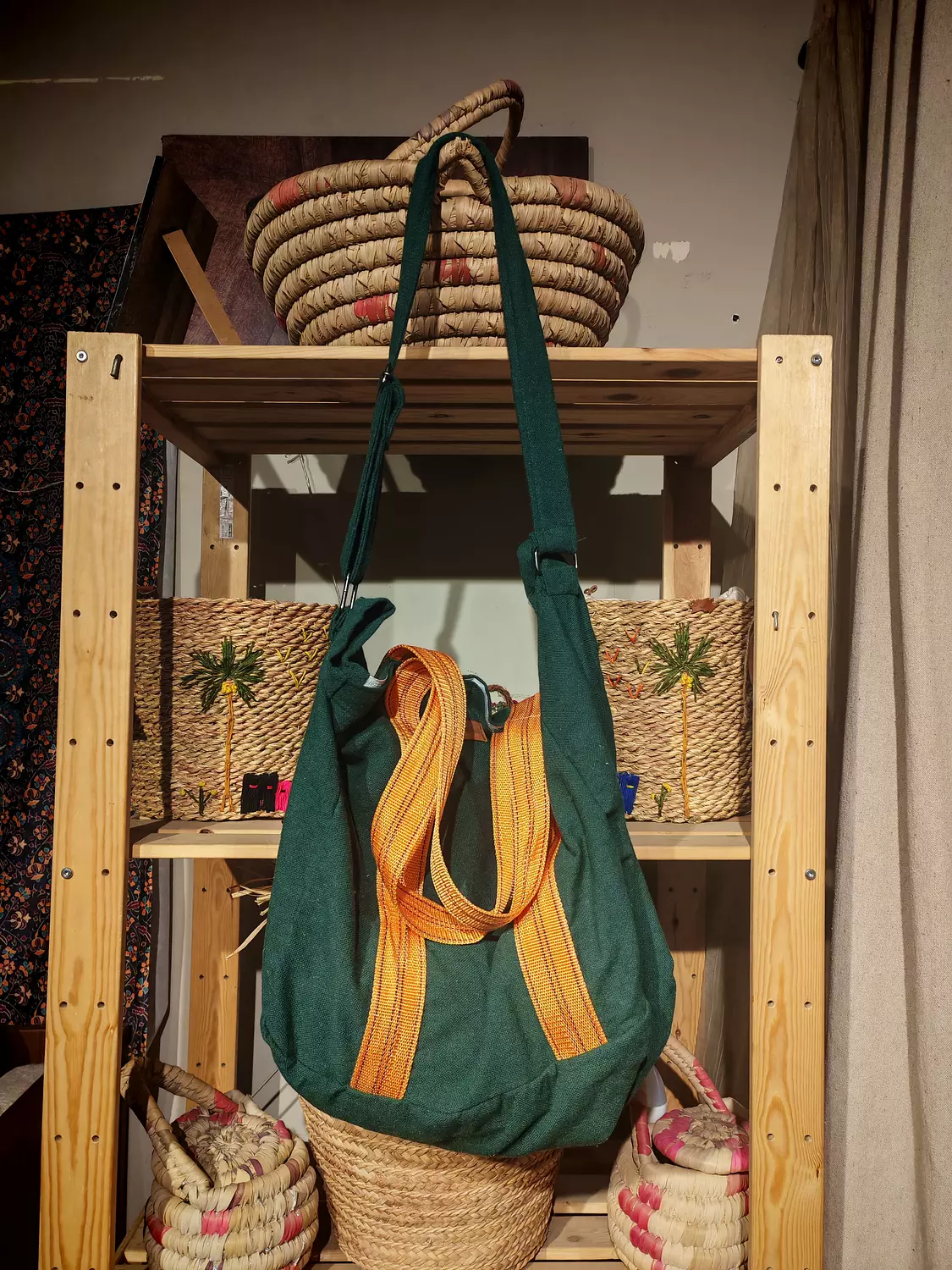 Extra large green bag with heavy duty orange strap hover image