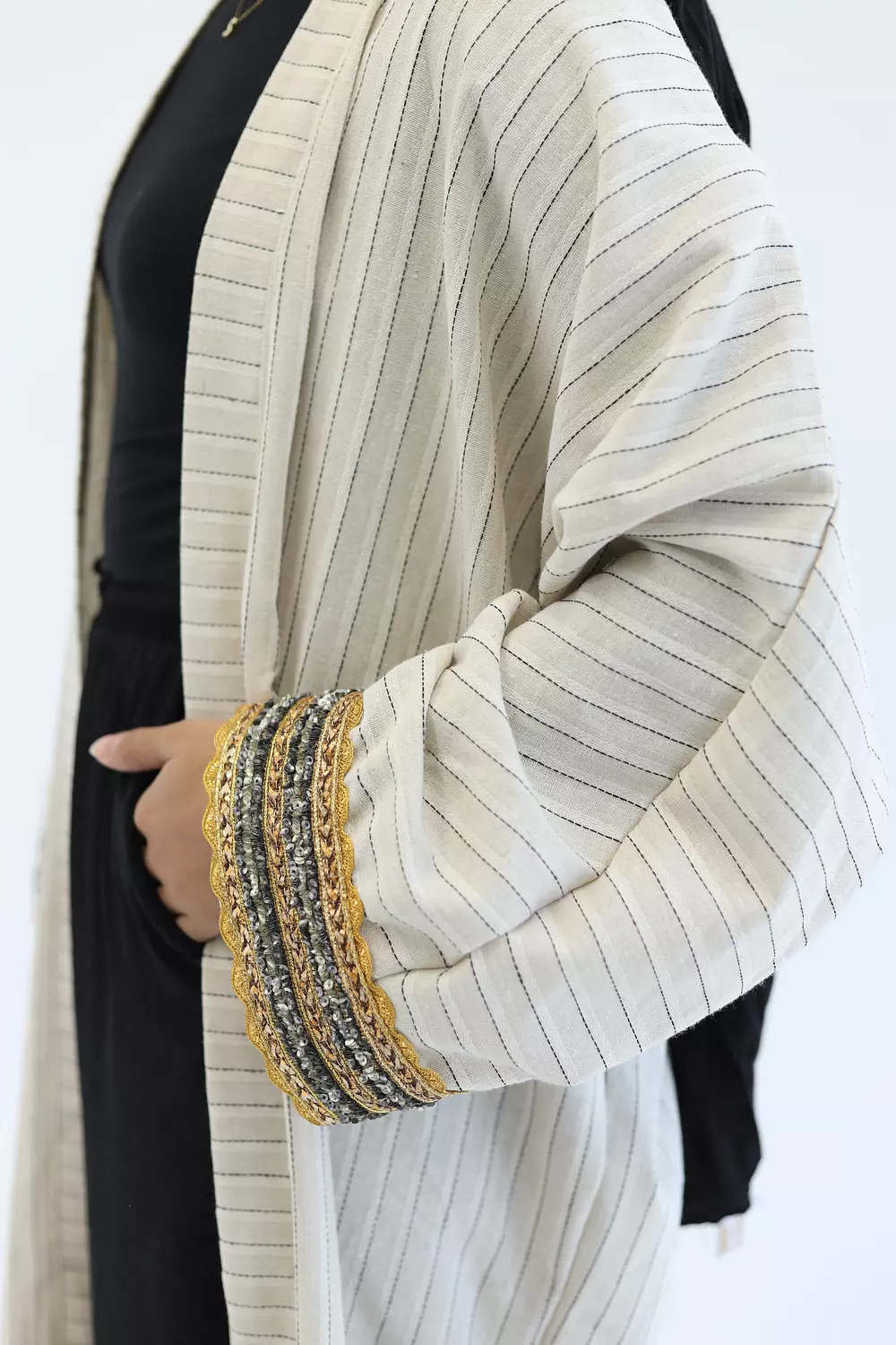 Striped cardigan with gold bracelet 4